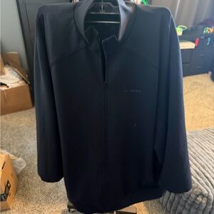 Nike x SKIMS Matte Tricot Oversized Track Jacket in the color obsidian.